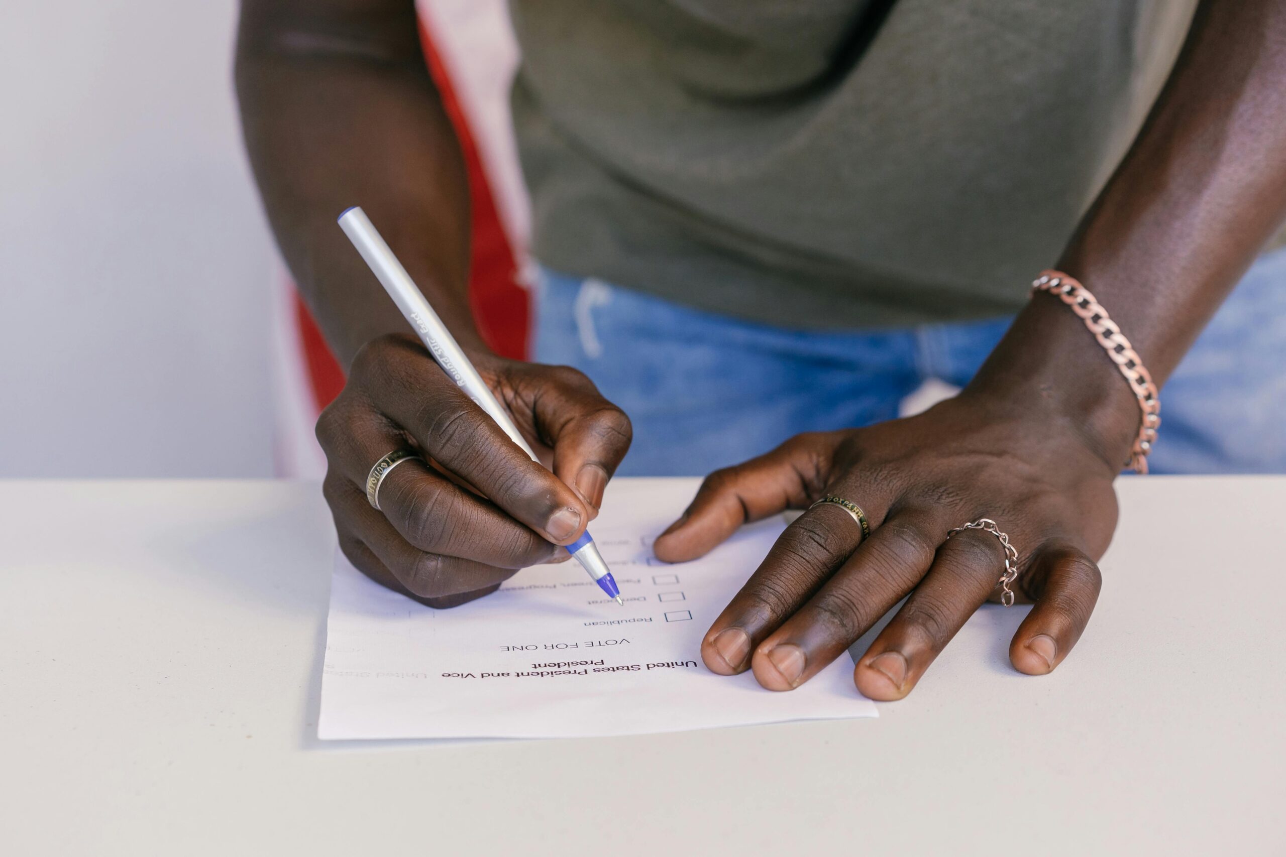 A close-up of a person marking a ballot paper during an election.